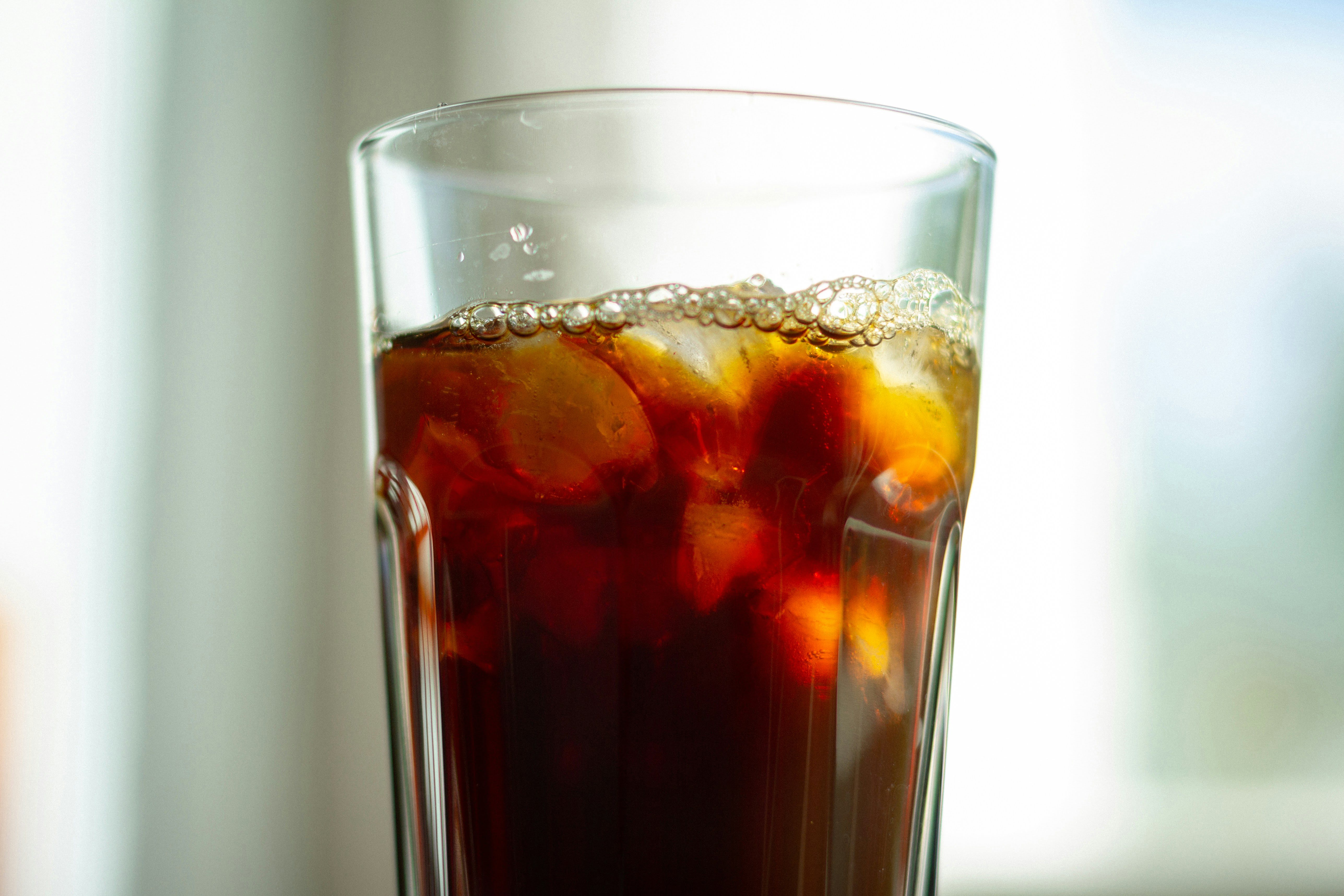 Cold brew coffee over ice in a tall glass made with small-batch specialty coffee beans from Wonder Waves Coffee