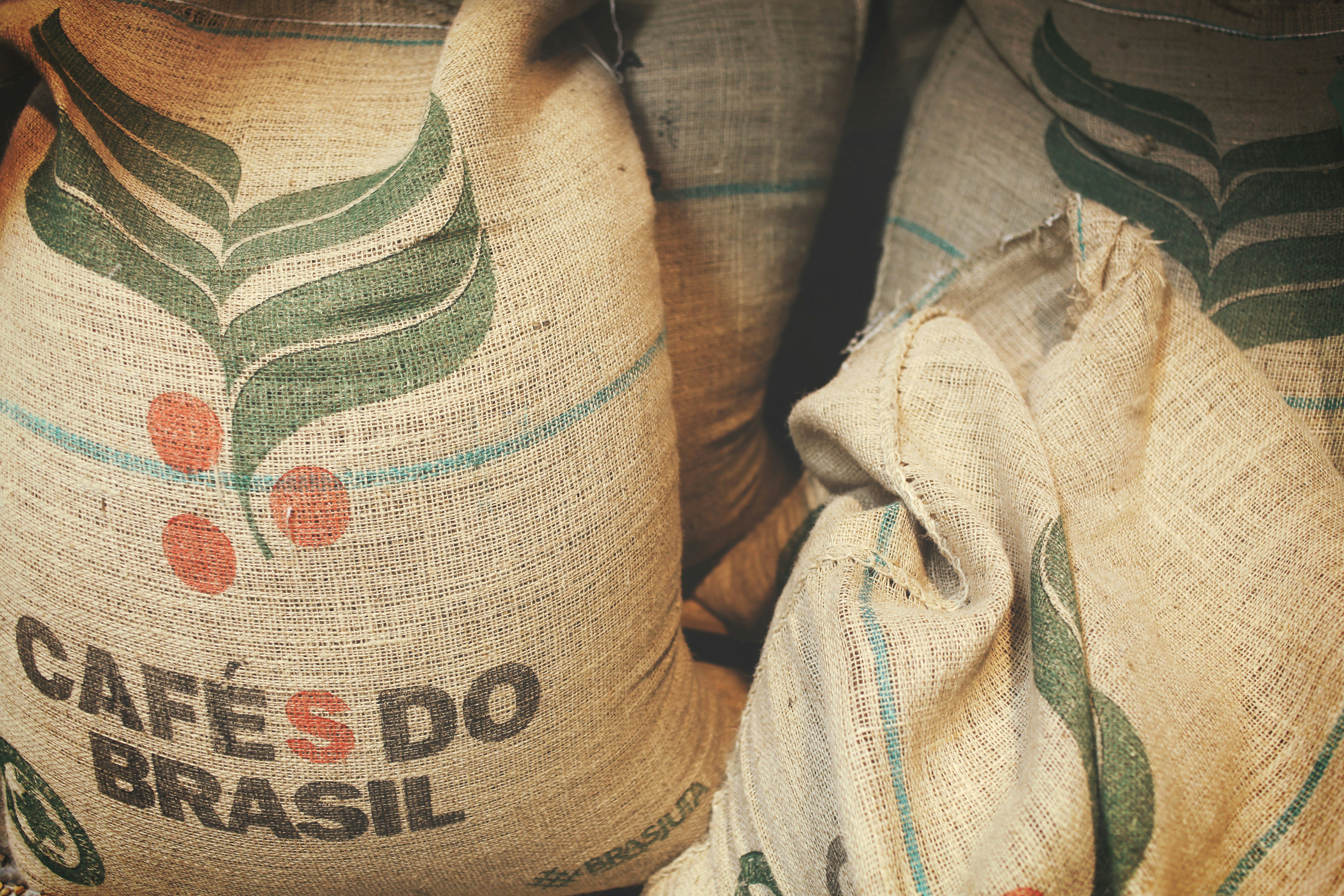 Burlap sacks of single-origin Brazil coffee beans sourced for Wonder Waves Coffee specialty roasts
