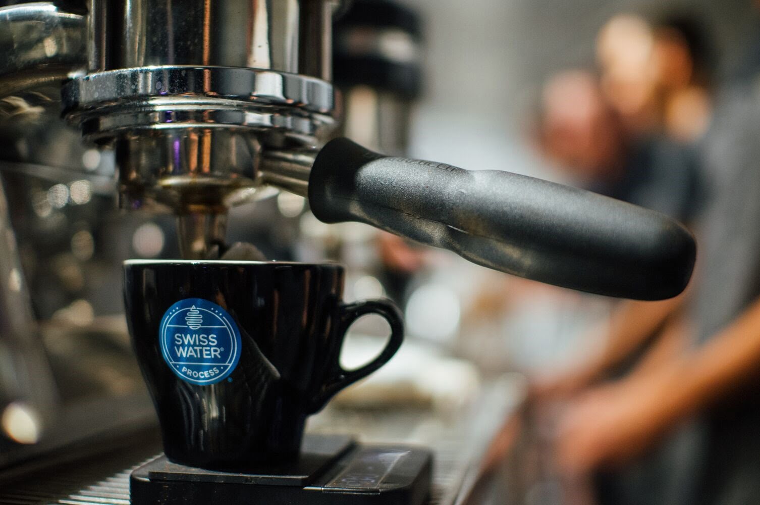 Swiss Water Process decaf coffee being pulled on an espresso machine — chemical-free specialty decaf at Wonder Waves Coffee
