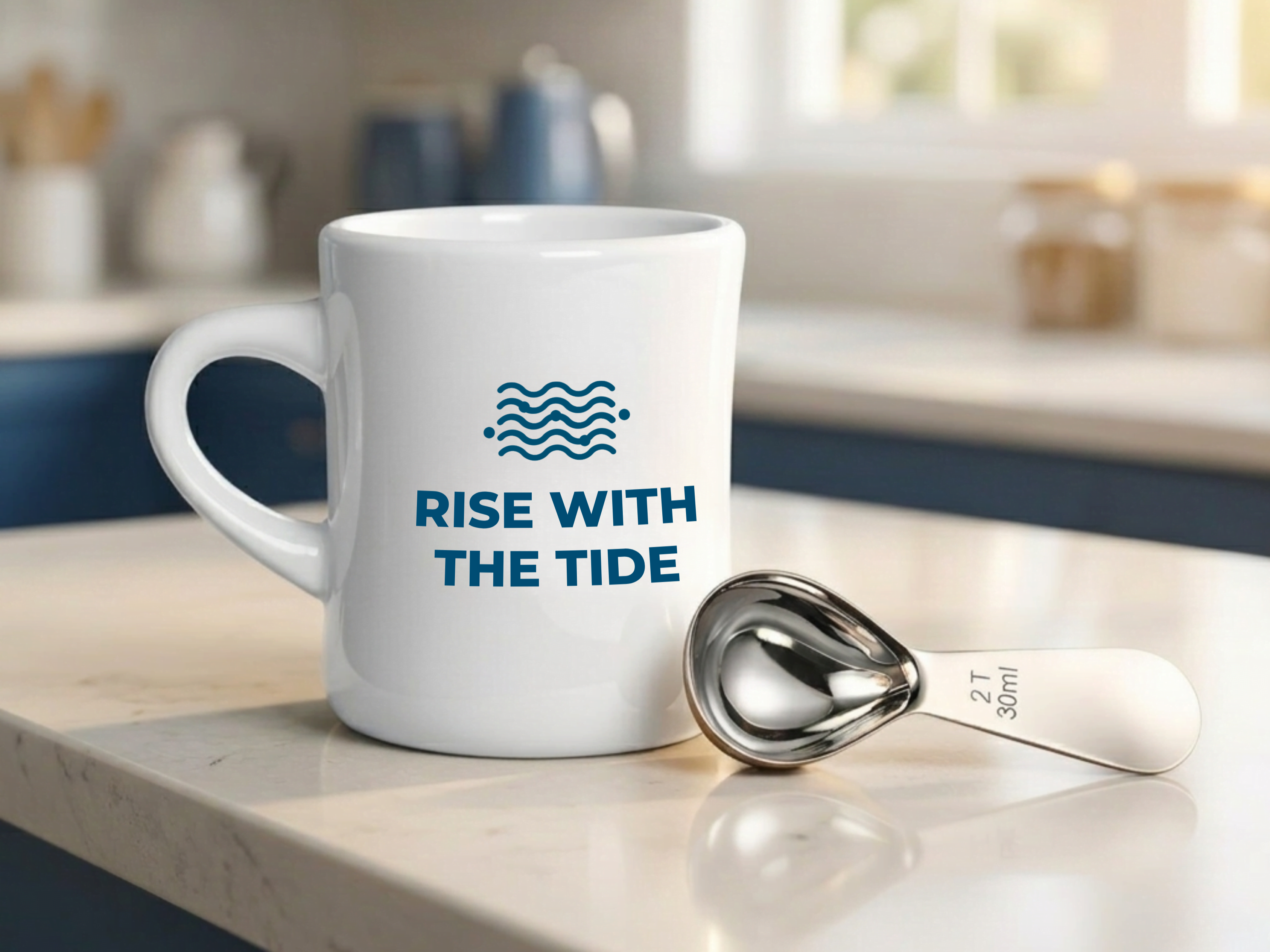 Wonder Waves Coffee Rise With The Tide white ceramic diner mug and stainless steel coffee scoop on a marble kitchen counter