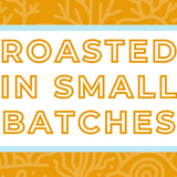 Text 'Roasted in Small Batches' on a white background, surrounded by a soft blue frame and a subtle yellow coral-themed backdrop, highlighting the artisan and small-batch roasting process for specialty coffee