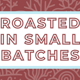 Text 'Roasted in Small Batches' on a white background, surrounded by a soft blue frame and a subtle crimson brown coral-themed backdrop, highlighting the artisan and small-batch roasting process for specialty coffee
