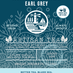 Harbor Haze Earl Grey tea packaging featuring a bright, aromatic, and floral loose leaf blend with bergamot and blue cornflowers. The label displays a lighthouse and sailboat design with ocean-inspired elements and emphasizes sustainability and ocean protection. Enjoy hot or iced.