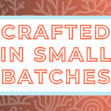 Text 'Crafted in Small Batches' on a white background, surrounded by a soft blue frame and a coral-toned and coral-themed backdrop, highlighting the artisan and small-batch blending process for artisan tea