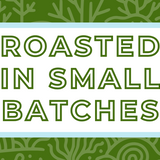Text 'Roasted in Small Batches' on a white background, surrounded by a soft blue frame and a subtle lush green coral-themed backdrop, highlighting the artisan and small-batch roasting process for specialty coffee