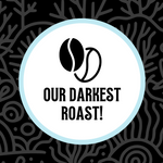 Stylized coffee bean icon above the text “Our Darkest Roast!” set on a deep black coral-inspired background, emphasizing bold, rich flavor