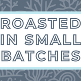 Text 'Roasted in Small Batches' on a white background, surrounded by a soft blue frame and a subtle grayish blue coral-themed backdrop, highlighting the artisan and small-batch roasting process for specialty coffee