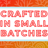 Text 'Crafted in Small Batches' on a white background, surrounded by a soft blue frame and a vibrant red and orange coral-themed backdrop, highlighting the artisan and small-batch blending process for artisan tea