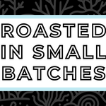 Text 'Roasted in Small Batches' on a white background, surrounded by a soft blue frame and a subtle black coral-themed backdrop, highlighting the artisan and small-batch roasting process for specialty coffee