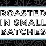 Text 'Roasted in Small Batches' on a white background, surrounded by a soft blue frame and a subtle black coral-themed backdrop, highlighting the artisan and small-batch roasting process for specialty coffee