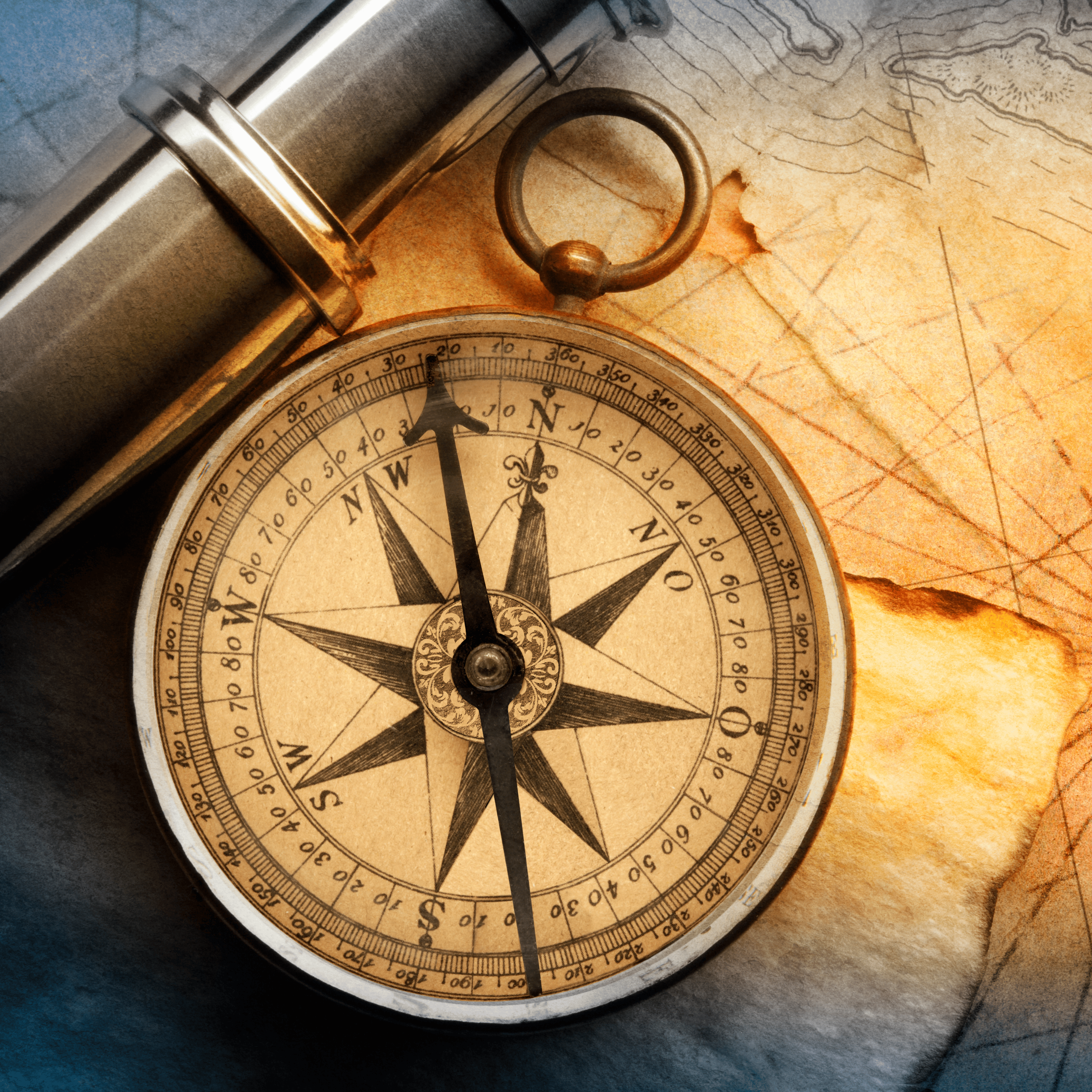 Close-up of a vintage compass and map, symbolizing guidance and exploration for Captain's Compass, a curated coffee subscription with exceptional global selections