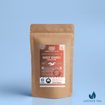 Sassy Seagull Masala Chai black tea packaging with a rustic kraft pouch design, featuring a warm brown-orange ocean-themed label with a flying seagull illustration, flavor descriptors, and the ‘Artisan Tea’ label. Includes branding for Wonder Waves Coffee, highlighting its spiced, malty, and bold profile and eco-friendly packaging.