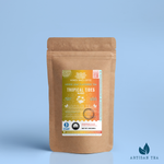 Tropical Tides Mango black tea packaging with a rustic kraft pouch design, featuring a golden-orange ocean-themed label with a hammock and palm tree illustration, flavor notes, and the ‘Artisan Tea’ label. Includes branding for Wonder Waves Coffee, highlighting its fruity, sweet, and lively character and sustainable packaging.