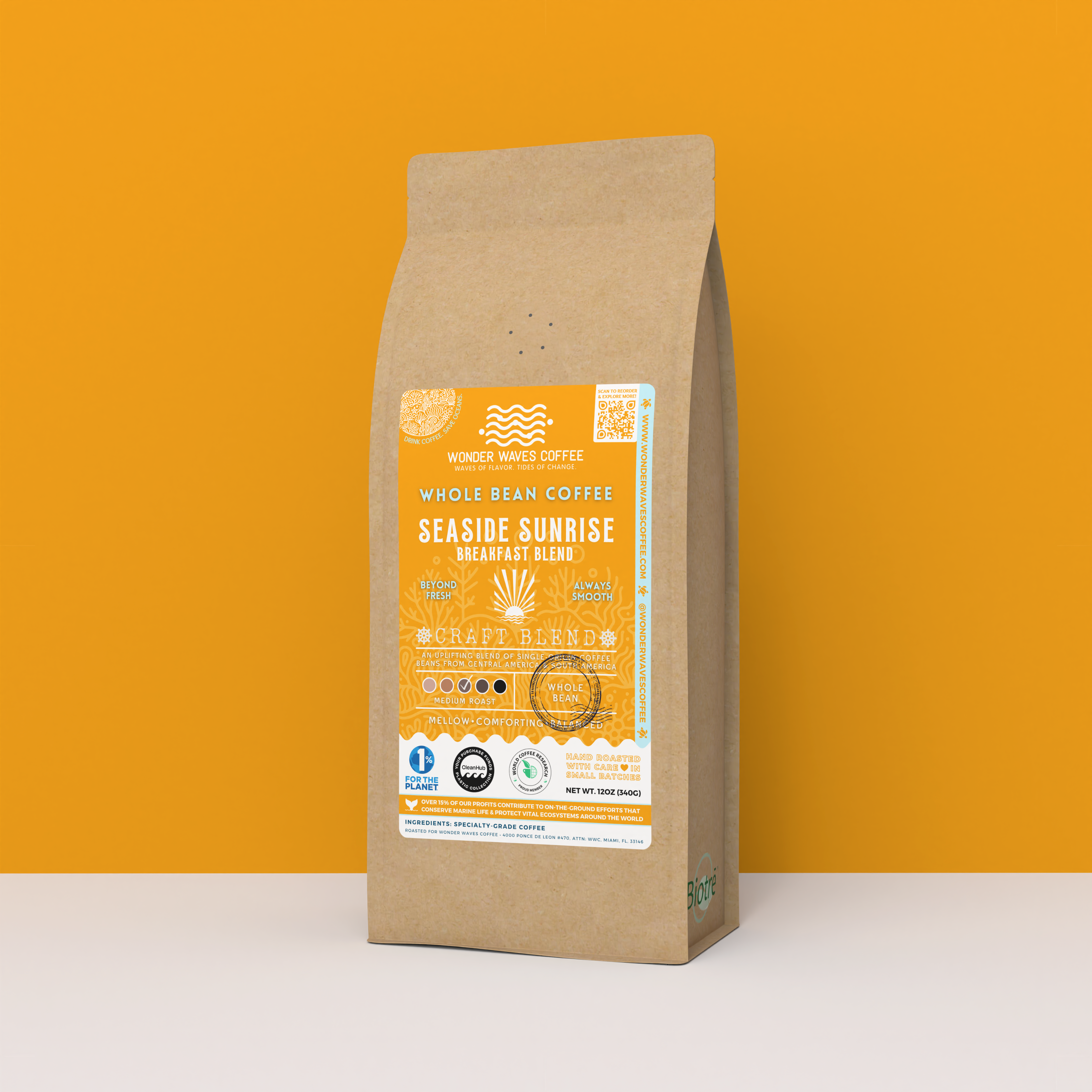 Seaside Sunrise Breakfast Blend whole bean coffee packaging with a rustic kraft bag design, featuring a bright orange ocean-themed label with a sunburst illustration, coffee roast icons, and the ‘Craft Blend’ label. Includes branding for Wonder Waves Coffee, emphasizing its medium roast and eco-friendly packaging.