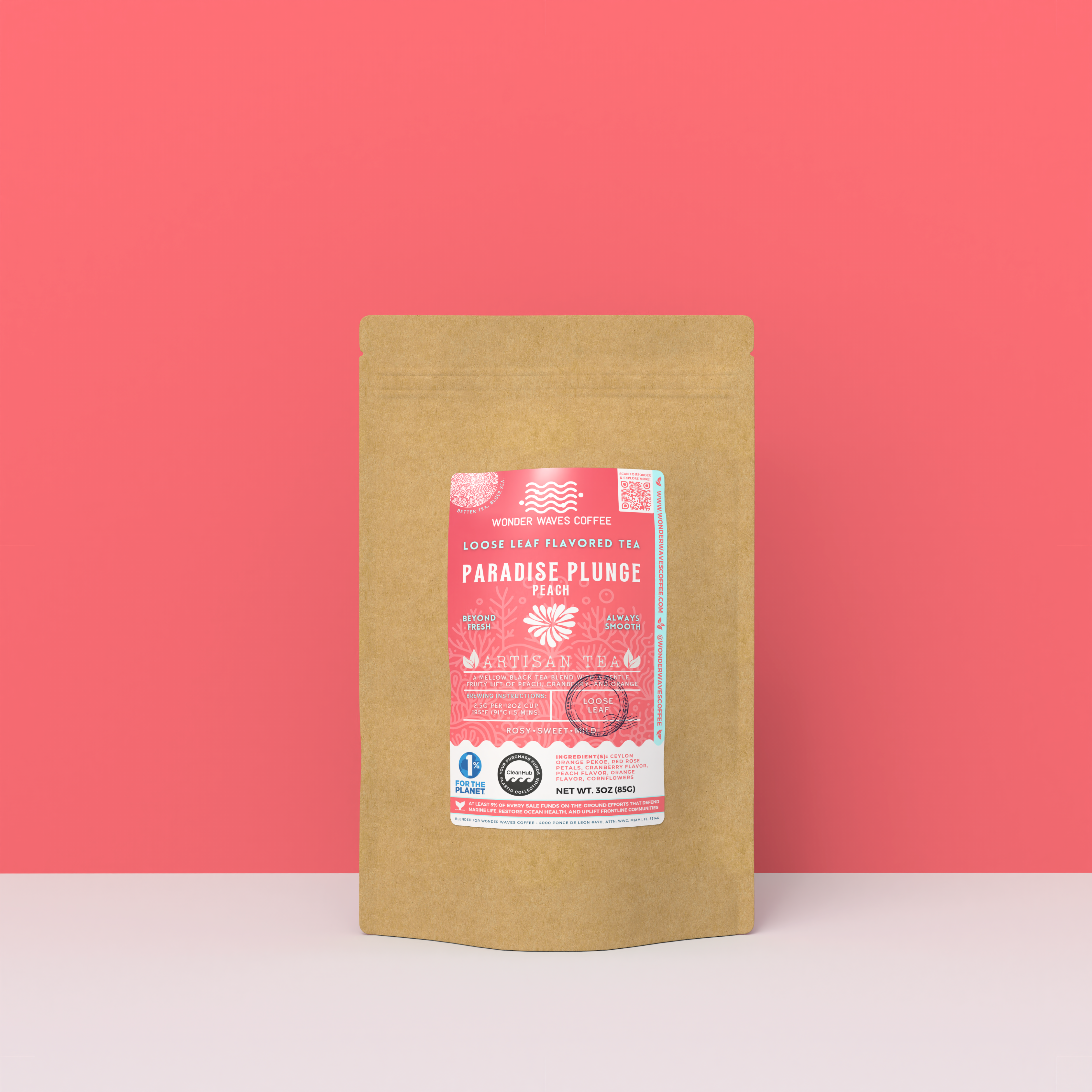 Paradise Plunge Peach black tea packaging with a rustic kraft pouch design, featuring a coral-pink ocean-themed label with a floral burst illustration, flavor notes, and the ‘Artisan Tea’ label. Includes branding for Wonder Waves Coffee, highlighting its rosy, sweet, and mild character and eco-conscious packaging.