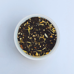 Close-up of Sassy Seagull loose-leaf masala chai black tea in a white bowl on a white background by Wonder Waves Coffee