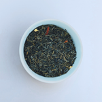 Close-up of Gulfstream Glow loose-leaf jasmine green tea in a white bowl on a white background by Wonder Waves Coffee