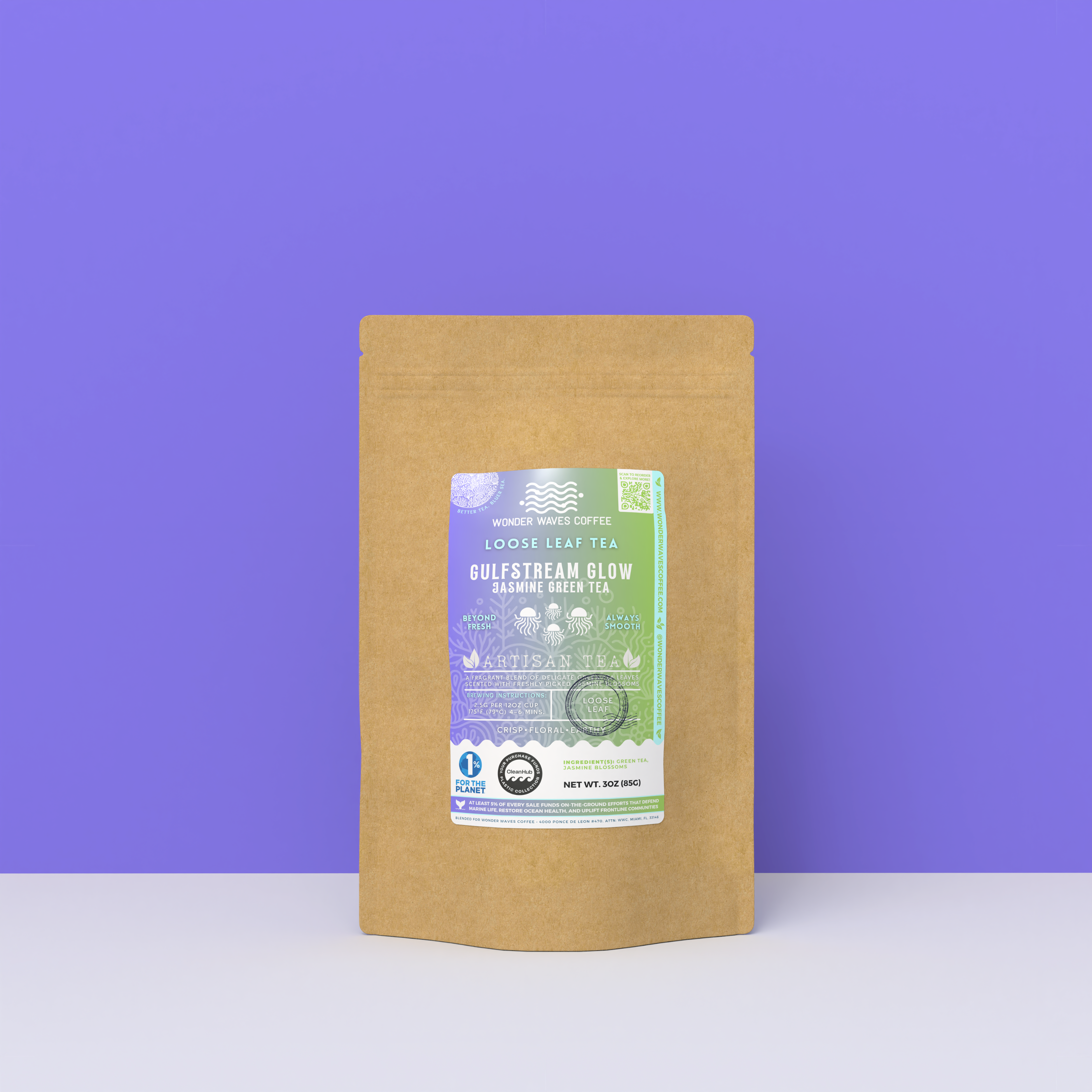 Gulfstream Glow Jasmine Green Tea packaging with a rustic kraft pouch design, featuring a gradient purple-to-green ocean-themed label with jellyfish illustrations, flavor descriptors, and the ‘Artisan Tea’ label. Includes branding for Wonder Waves Coffee, emphasizing its crisp, floral, and earthy profile and eco-friendly packaging.