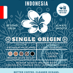 Bali Blue Indonesia Single Origin coffee packaging featuring a medium-dark roast with medium acidity and rich flavors of chocolate, orange peel, juniper, and molasses. Eco-conscious branding supporting cleaner oceans.
