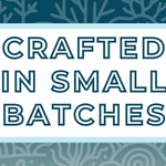 Text 'Crafted in Small Batches' on a white background, surrounded by a soft blue frame and a misty and deep blue coral-themed backdrop, highlighting the artisan and small-batch blending process for artisan tea
