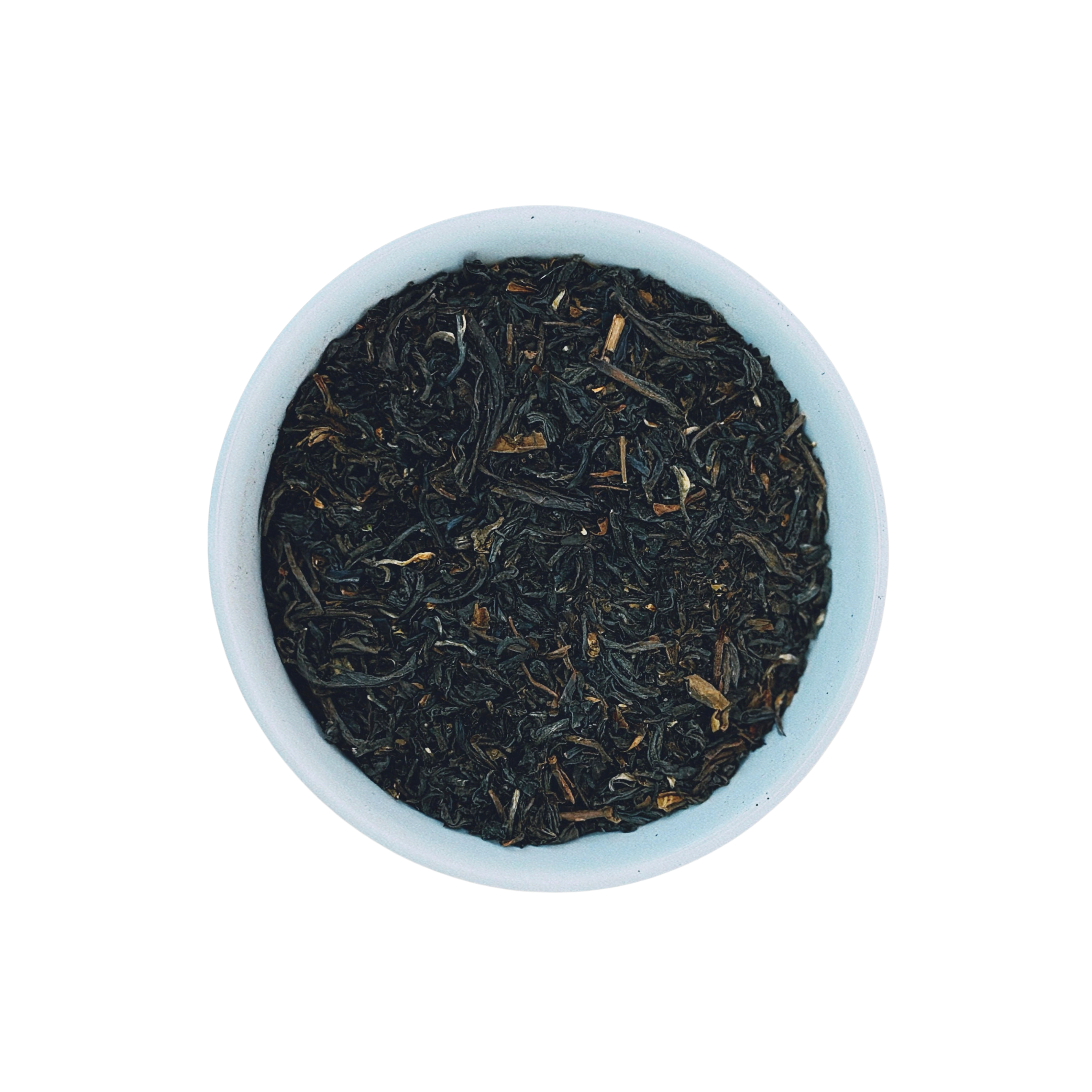 Mighty Monarch English Breakfast loose leaf black tea in white bowl close-up by Wonder Waves Coffee featuring a robust, malty and brisk flavor profile