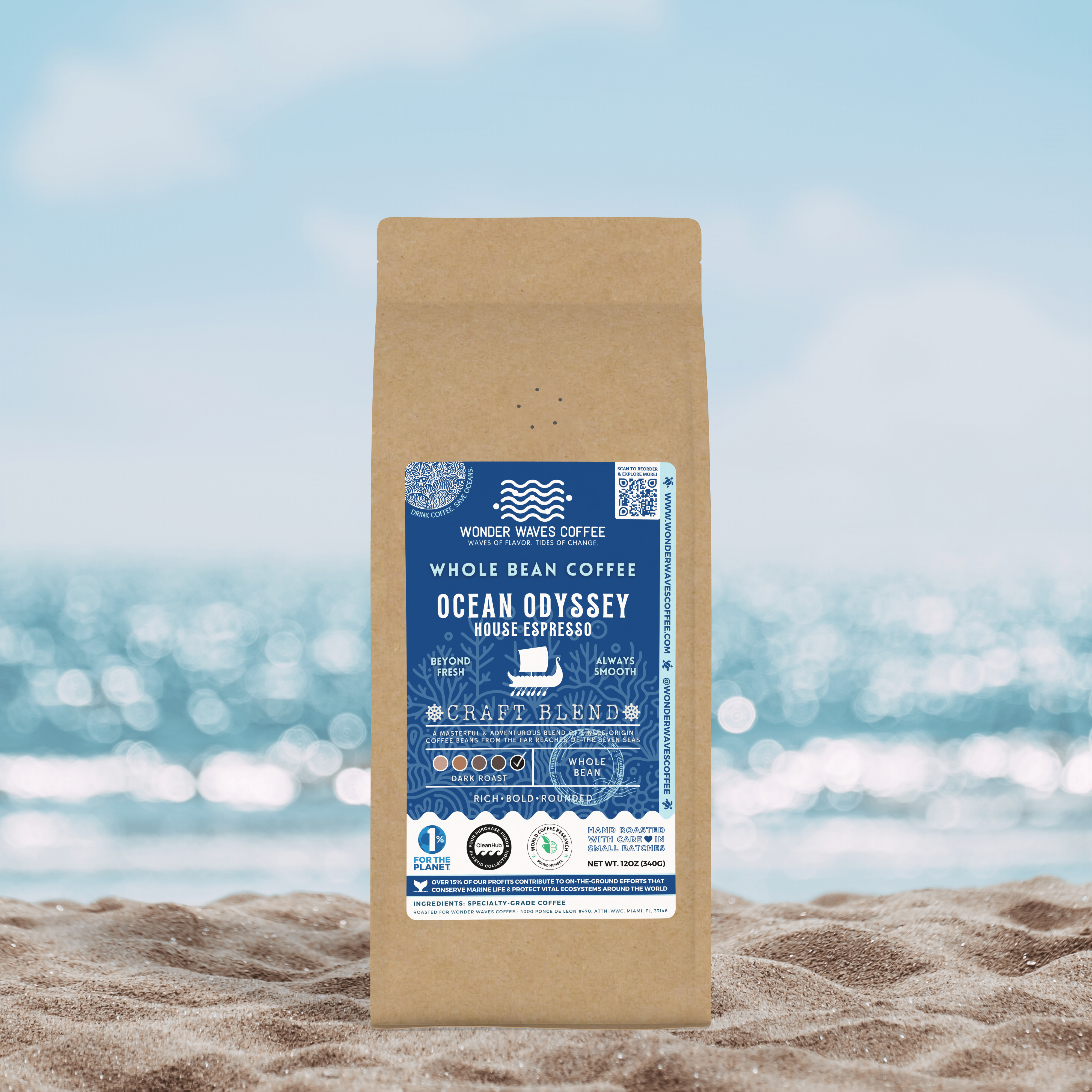 Wonder Waves Coffee’s Ocean Odyssey House Espresso, a rich and bold craft blend, placed on sandy beach with ocean in the background, embodying an ocean-inspired journey