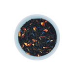 Paradise Plunge Peach loose leaf black tea in white bowl close-up by Wonder Waves Coffee featuring smooth peach notes and a gentle fruity finish