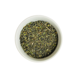 Tangier Tingle Moroccan Mint loose leaf green tea in white bowl close-up by Wonder Waves Coffee featuring crisp mint and refreshing earthy green tea notes