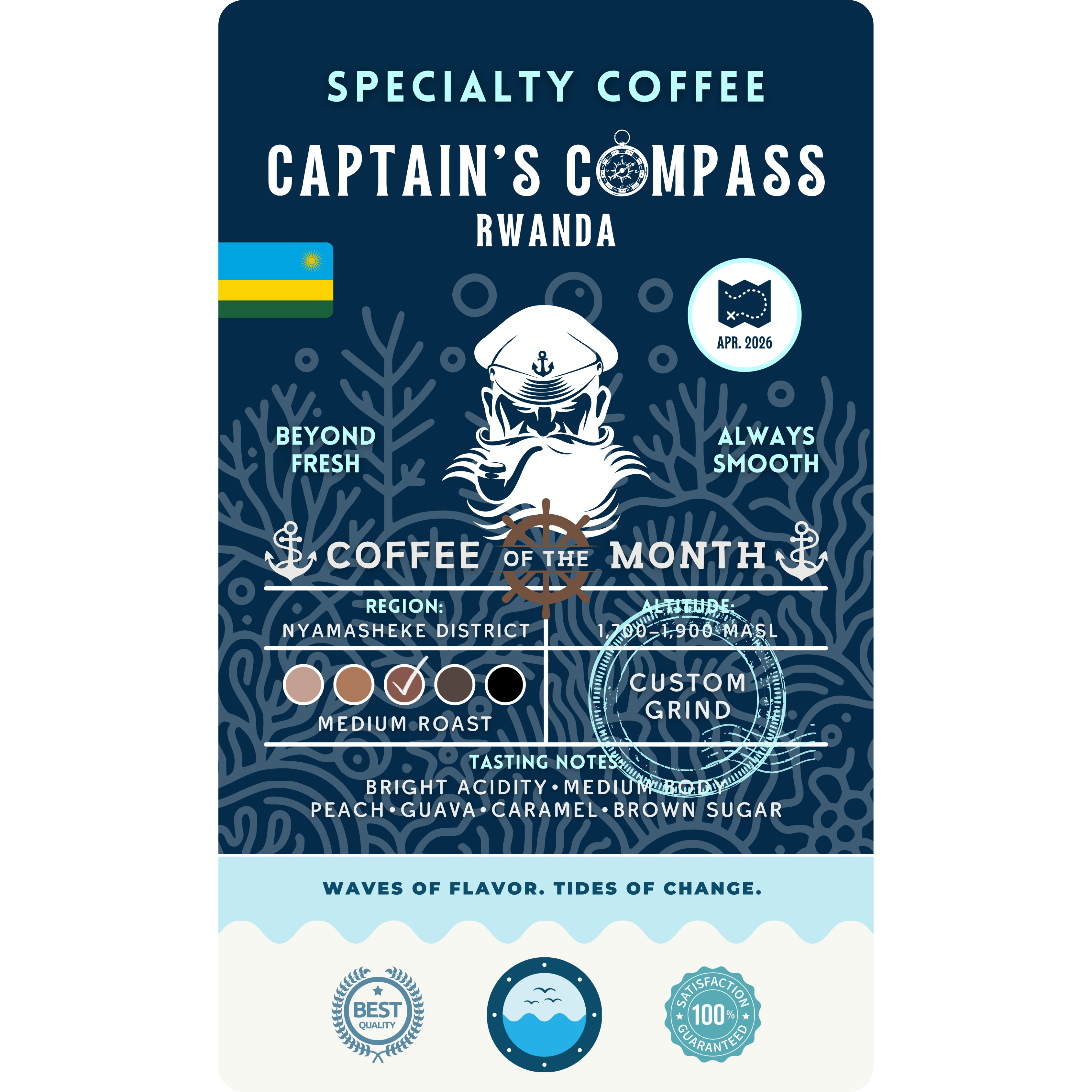 Product label for Wonder Waves "Captain's Compass" Coffee of the Month featuring Rwanda Nyamasheke District beans. The navy blue label shows a white sea captain illustration and the Rwanda flag. It is a medium roast with bright acidity and tasting notes of peach, guava, caramel, and brown sugar, grown at 1,700 to 1,900 MASL.