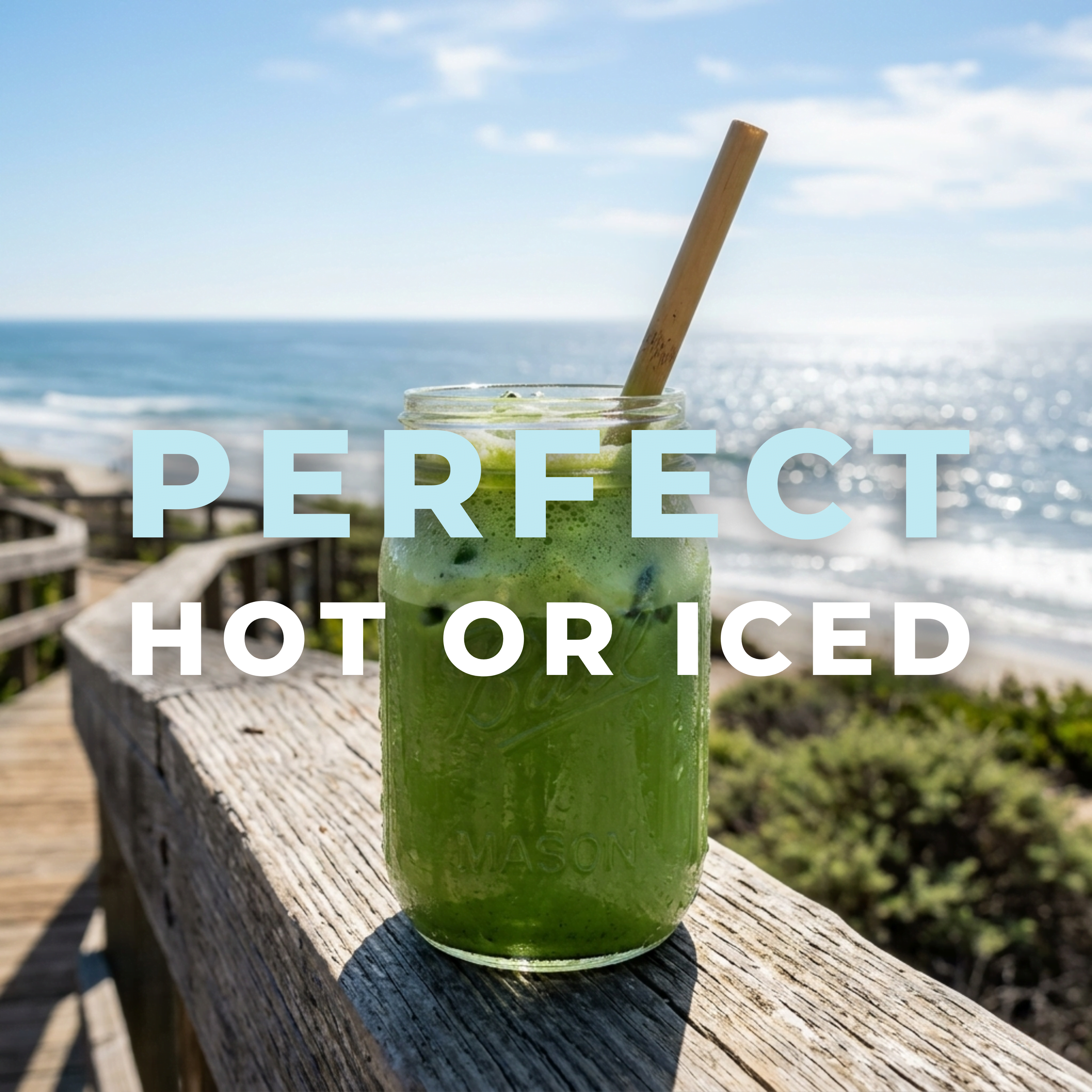 Wonder Waves Coffee iced ceremonial grade matcha latte in a glass mason jar with a bamboo straw on a coastal wooden boardwalk. Text overlay reads "PERFECT HOT OR ICED" against a sunny beach and ocean backdrop.
