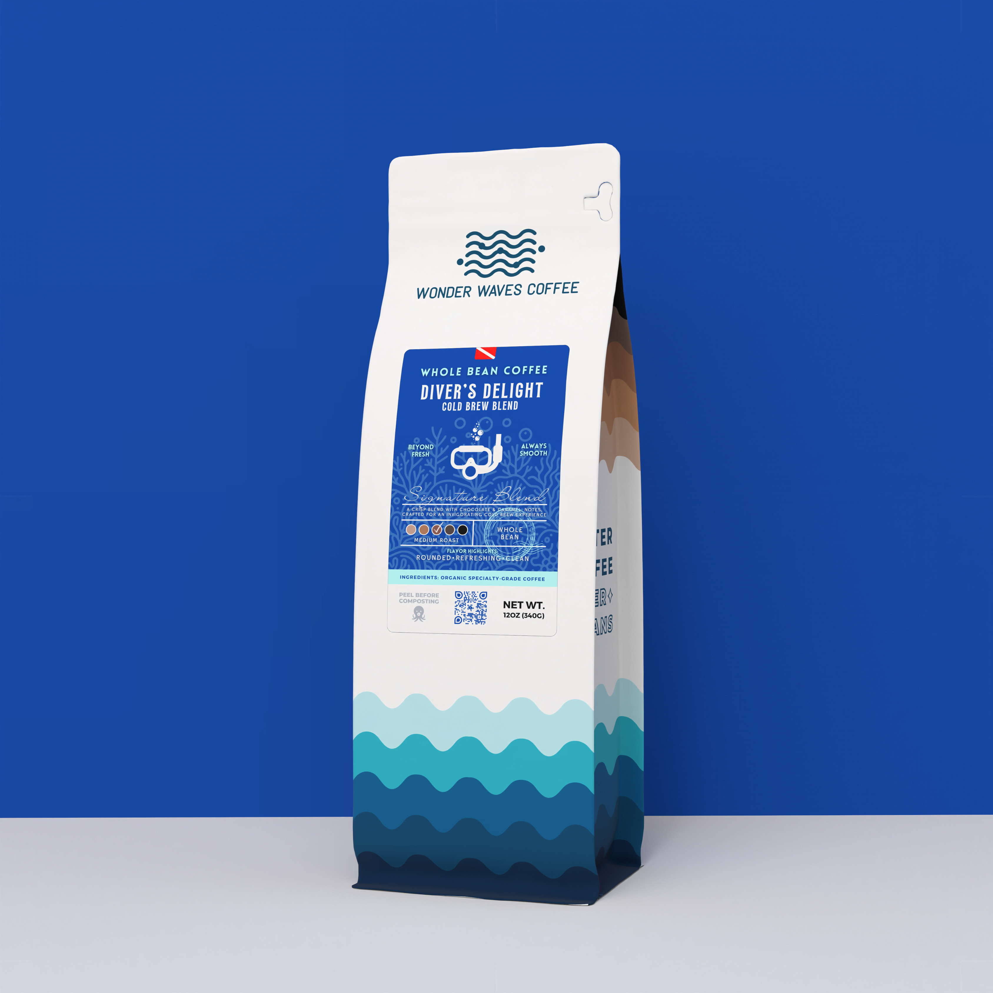 Wonder Waves Coffee Diver’s Delight 12oz bag, a specialty cold brew blend with a royal blue ocean theme and diving mask icon.
