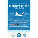 Product label for "Mermaid’s Melody" French Vanilla ground flavored coffee. The design shows a white silhouette of a mermaid against a medium-blue coral pattern. It is described as a medium roast signature blend with sweet, velvety, and balanced flavor notes.
