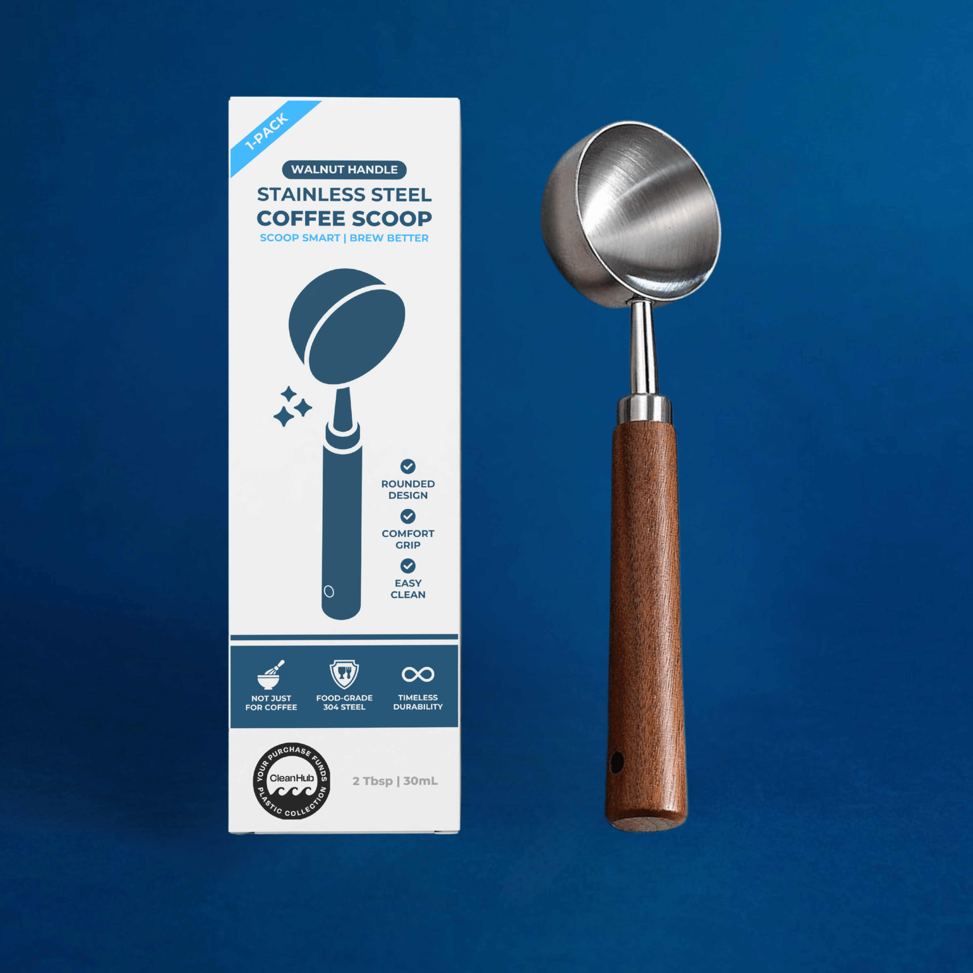 Wonder Waves Coffee walnut handle stainless steel coffee scoop 2 tablespoon 30ml beside its product packaging box on a navy background